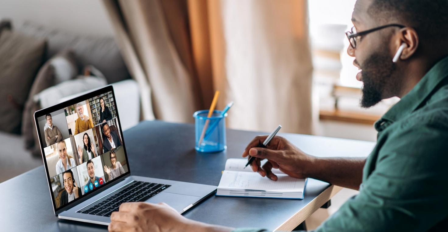 Person reviewing financial documents with thoughtful consideration